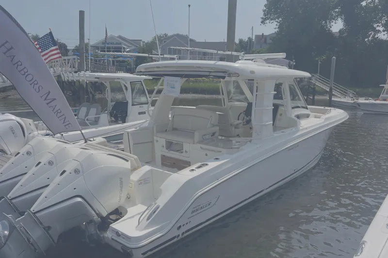  Yacht Photos Pics 2020 Boston Whaler 350 Realm boat docked at marina with triple outboard engines.