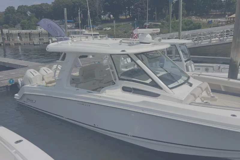  Yacht Photos Pics 2020 Boston Whaler 350 Realm boat docked at a marina.
