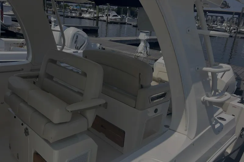  Yacht Photos Pics 2020 Boston Whaler 350 Realm interior with luxurious seating at marina.