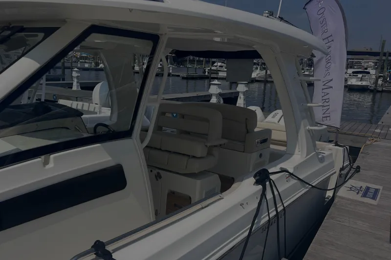  Yacht Photos Pics 2020 Boston Whaler 350 Realm docked at marina, showcasing sleek design and luxury seating.