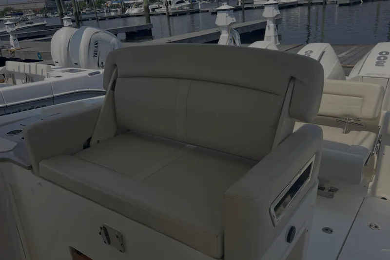  Yacht Photos Pics 2020 Boston Whaler 350 Realm boat seating area at marina dock.