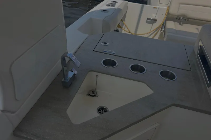  Yacht Photos Pics 2020 Boston Whaler 350 Realm boat interior with sink and cup holders.