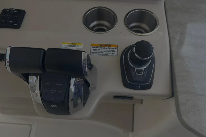  Yacht Photos Pics Control panel of a 2020 Boston Whaler 350 Realm boat with throttle and joystick.