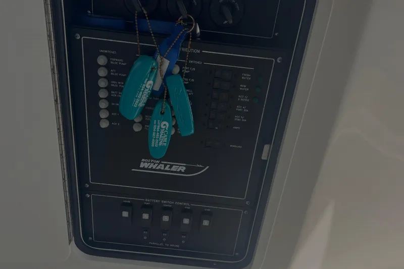  Yacht Photos Pics Control panel of a 2020 Boston Whaler 350 Realm boat with keychains attached.