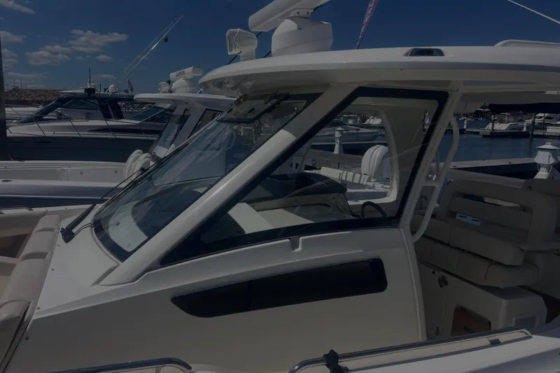  Yacht Photos Pics 2020 Boston Whaler 350 Realm boat docked at marina under clear blue sky.