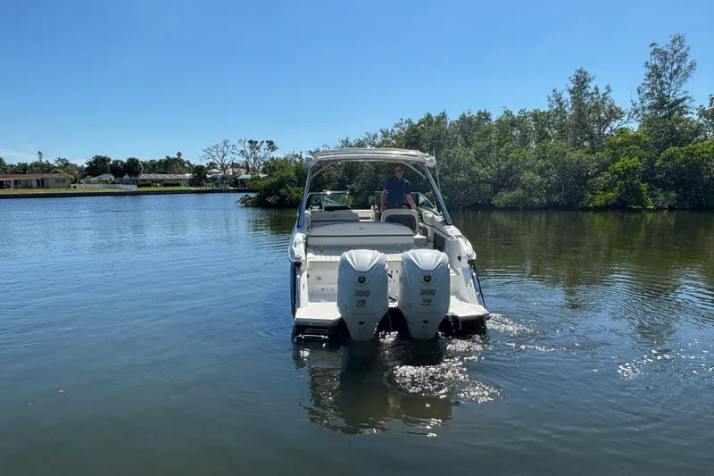  Yacht Photos Pics 2022 Cobalt 30SC boat with dual engines on a calm lake.