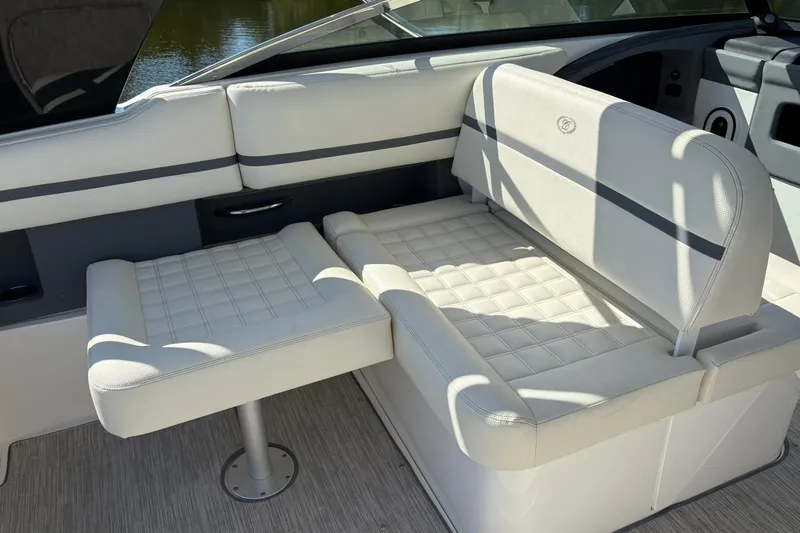  Yacht Photos Pics 2022 Cobalt 30SC boat interior with white cushioned seating and elegant design.