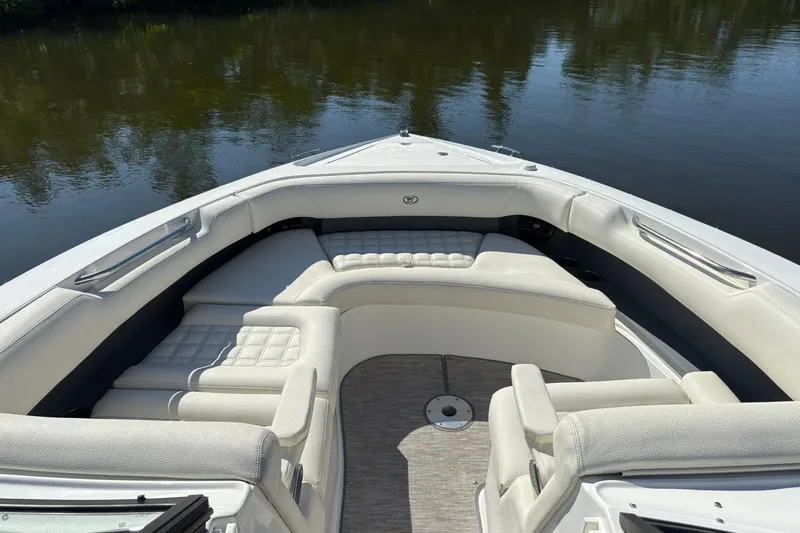  Yacht Photos Pics Luxurious seating on 2022 Cobalt 30SC boat, docked on calm water.