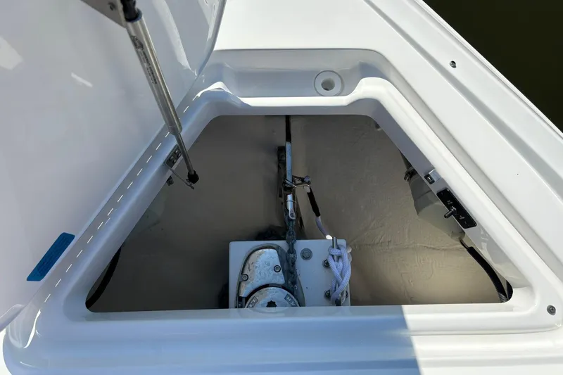  Yacht Photos Pics Open anchor compartment on 2022 Cobalt 30SC boat, showing anchor and rope storage.