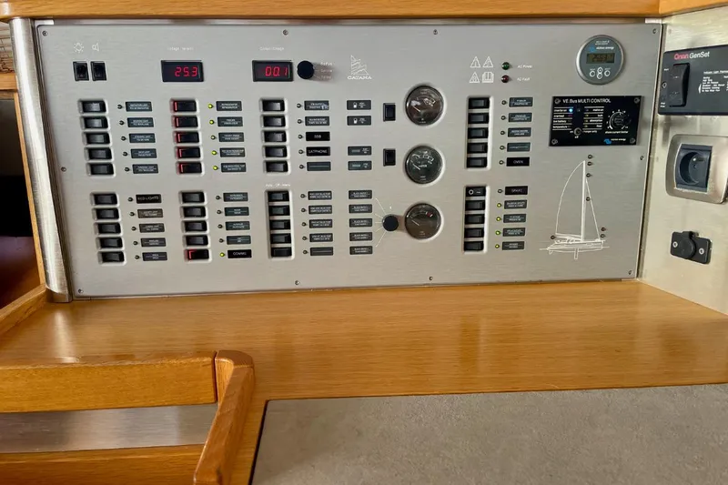 Hera Yacht Photos Pics Electrical control panel on a 2008 Catana 50 yacht, featuring switches and gauges.