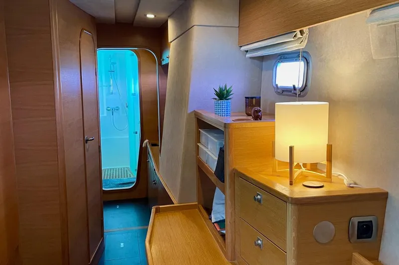 Hera Yacht Photos Pics Interior of 2008 Catana 50 yacht with wooden cabinetry and modern lighting.