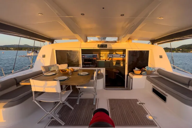 Hera Yacht Photos Pics Catana 50 catamaran interior, 2008 model, featuring a dining area with scenic ocean view.