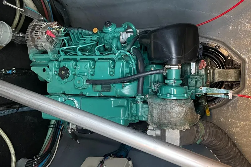 Hera Yacht Photos Pics Engine compartment of a 2008 Catana 50 yacht, showcasing a green marine engine.