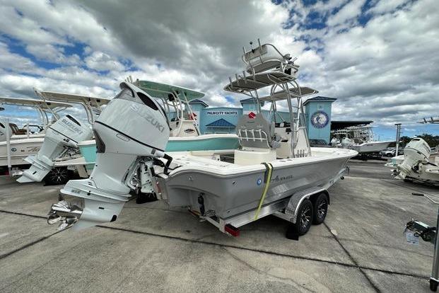 2024 Avenger AV26 boat with Suzuki outboard motor on trailer, displayed outdoors.