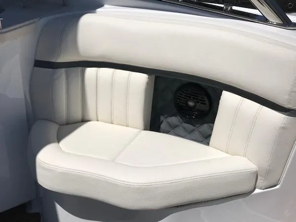  Yacht Photos Pics 2018 Cobalt R35 boat interior with white cushioned seating and built-in speaker.