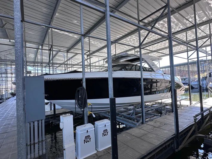  Yacht Photos Pics 2023 Sea Ray SLX 400 OB boat docked in a covered marina.