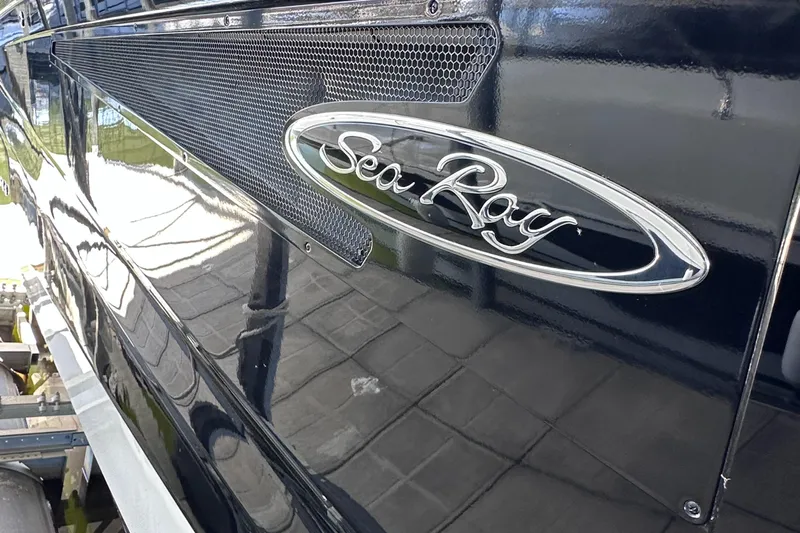  Yacht Photos Pics 2023 Sea Ray SLX 400 OB boat, close-up of logo on sleek black exterior.