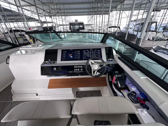  Yacht Photos Pics 2023 Sea Ray SLX 400 OB helm with modern controls and spacious seating.