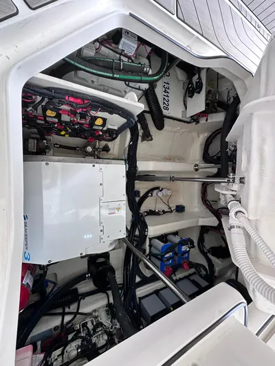  Yacht Photos Pics Engine compartment of 2023 Sea Ray SLX 400 OB, showcasing mechanical components and wiring.