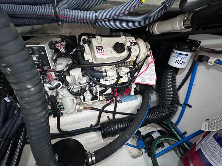  Yacht Photos Pics Engine compartment of 2023 Sea Ray SLX 400 OB with visible wiring and components.