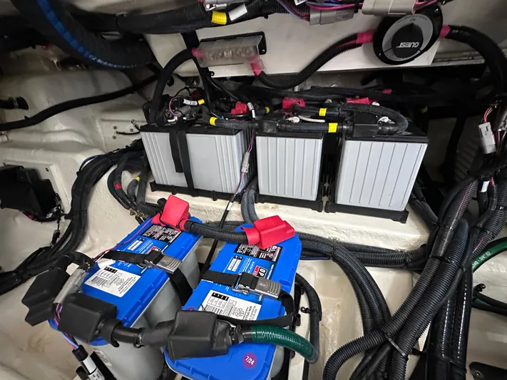  Yacht Photos Pics Battery compartment of 2023 Sea Ray SLX 400 OB boat with wiring and connections.