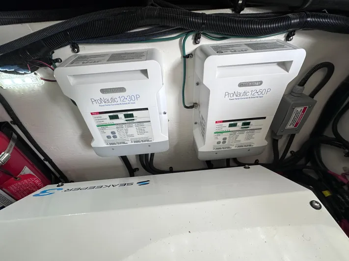  Yacht Photos Pics Electrical components in a 2023 Sea Ray SLX 400 OB boat engine compartment.