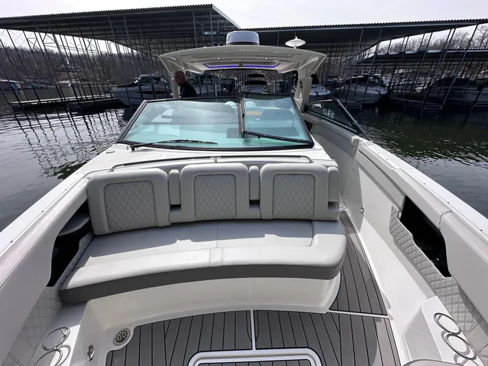  Yacht Photos Pics 2023 Sea Ray SLX 400 OB boat interior with cushioned seating and sleek design.