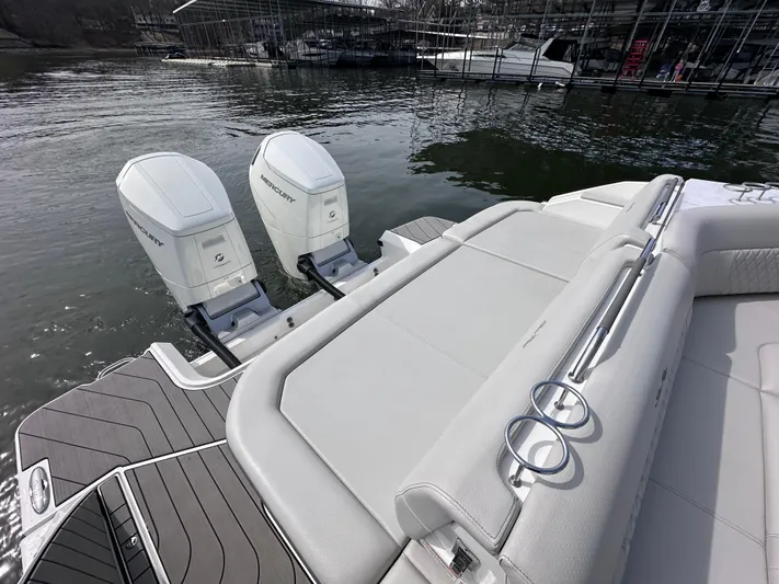 Yacht Photos Pics 2023 Sea Ray SLX 400 OB boat with dual outboard engines on a calm water dock.