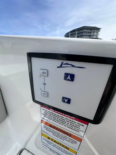  Yacht Photos Pics Control panel on a 2023 Sea Ray SLX 400 OB boat with warning labels.