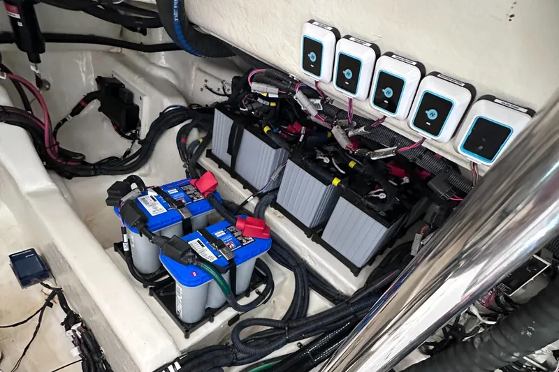  Yacht Photos Pics 2023 Sea Ray SLX 400 OB battery compartment with multiple batteries and wiring.