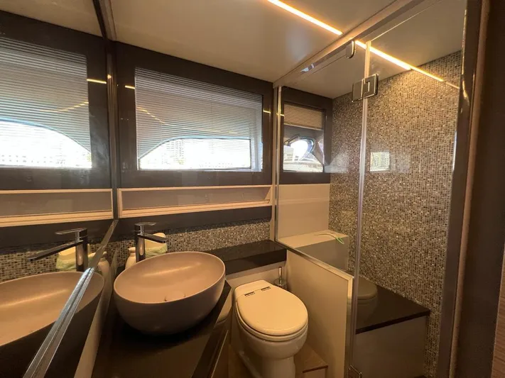  Yacht Photos Pics Luxurious bathroom in 2019 Pershing 5x yacht with modern fixtures and elegant design.