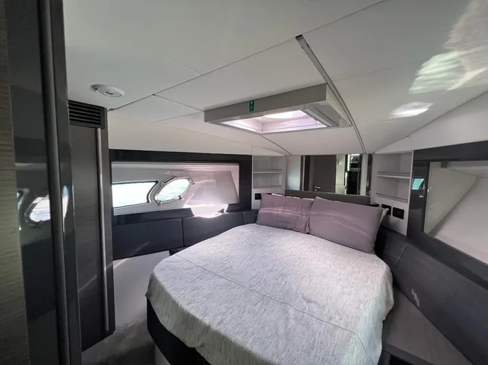  Yacht Photos Pics Luxurious bedroom interior of 2019 Pershing 5x yacht with modern design and cozy bedding.