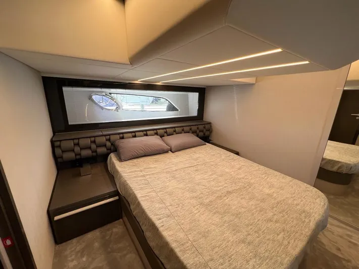  Yacht Photos Pics Luxurious bedroom interior of 2019 Pershing 5x yacht with modern design and cozy bedding.