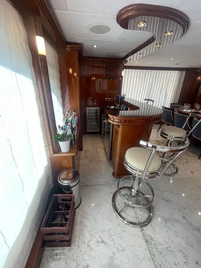 Sarah Sea Yacht Photos Pics Luxurious interior of 2004 Kaiserwerft Baron 102 yacht with elegant bar and seating area.