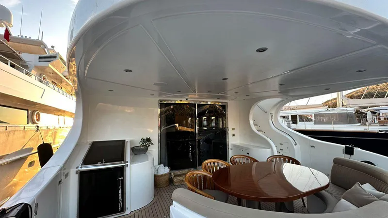 Sarah Sea Yacht Photos Pics Luxurious 2004 Kaiserwerft Baron 102 yacht deck with elegant seating and dining area.