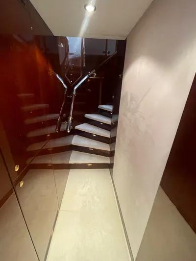 Sarah Sea Yacht Photos Pics Interior staircase of 2004 Kaiserwerft Baron 102 yacht, featuring sleek design and modern lighting.