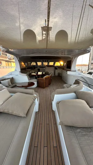 Sarah Sea Yacht Photos Pics Luxurious 2004 Kaiserwerft Baron 102 yacht with elegant deck seating and sunset view.