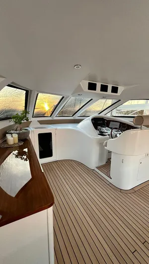 Sarah Sea Yacht Photos Pics Luxurious interior of 2004 Kaiserwerft Baron 102 yacht with sleek design and wooden flooring.