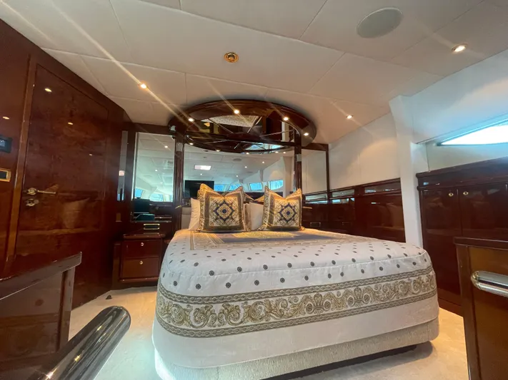 Sarah Sea Yacht Photos Pics Luxurious bedroom interior of 2004 Kaiserwerft Baron 102 yacht with elegant bedding and wood finishes.
