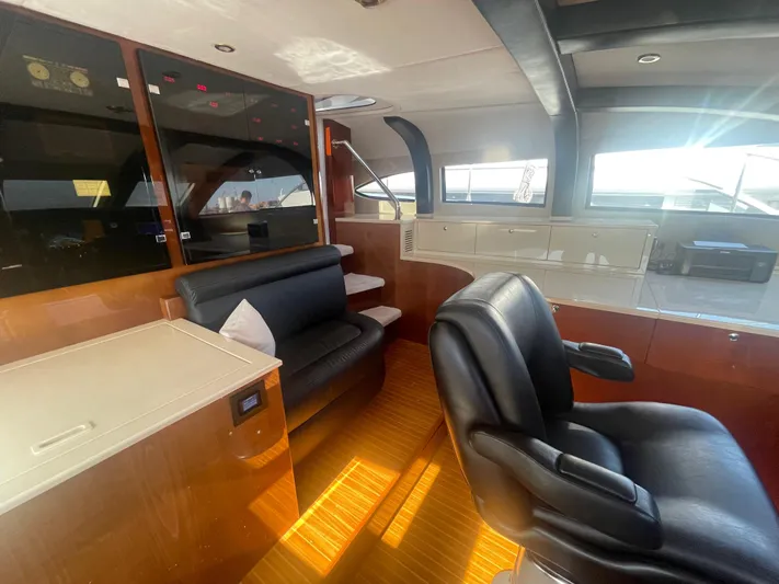 Sarah Sea Yacht Photos Pics Luxurious interior of 2004 Kaiserwerft Baron 102 yacht with leather seating and wood finishes.