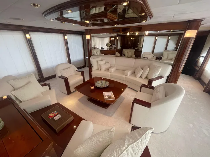 Sarah Sea Yacht Photos Pics Luxurious interior of 2004 Kaiserwerft Baron 102 yacht with elegant seating and wooden accents.