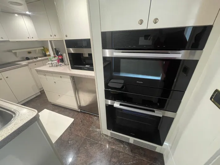 Sarah Sea Yacht Photos Pics Modern yacht kitchen with sleek appliances, featuring a Kaiserwerft Baron 102, 2004 model.