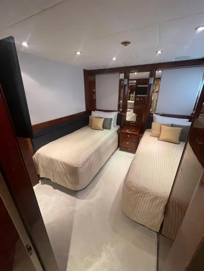 Sarah Sea Yacht Photos Pics Luxurious twin bedroom on 2004 Kaiserwerft Baron 102 yacht with elegant decor.