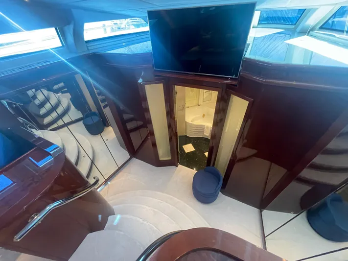 Sarah Sea Yacht Photos Pics Luxurious interior of 2004 Kaiserwerft Baron 102 yacht with elegant wood finishes and modern design.