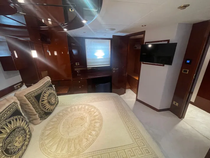 Sarah Sea Yacht Photos Pics Luxurious bedroom interior of 2004 Kaiserwerft Baron 102 yacht with elegant decor and modern amenities.