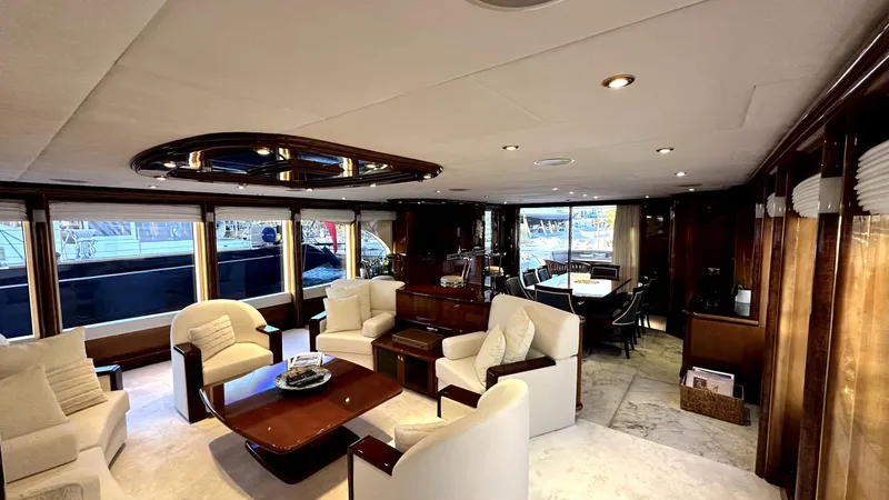 Sarah Sea Yacht Photos Pics Luxurious interior of 2004 Kaiserwerft Baron 102 yacht with elegant seating and dining area.