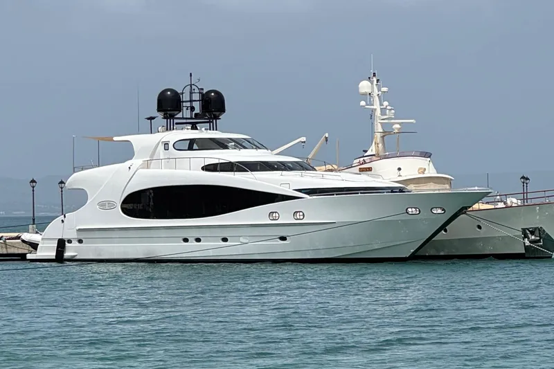 Sarah Sea Yacht Photos Pics Luxury yacht Kaiserwerft Baron 102, 2004 model, docked in a marina.