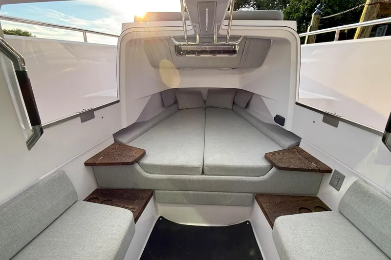 Raven Yacht Photos Pics 2021 Axopar 37 XC CROSS CABIN interior with cozy seating and modern design.