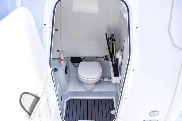  Yacht Photos Pics 2025 Sea Hunt Gamefish 28 Forward Seating boat interior with compact marine toilet.