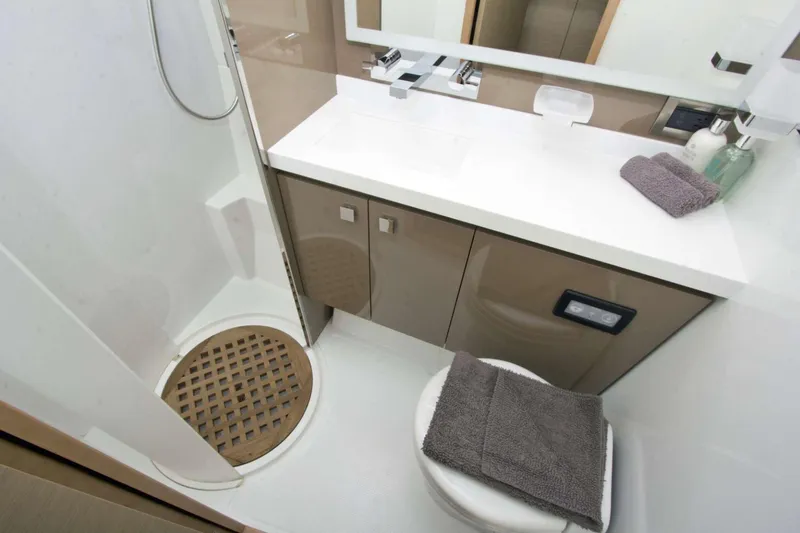Neverland Yacht Photos Pics Modern bathroom in 2018 Fountaine Pajot Catamaran 67, featuring sleek design and amenities.